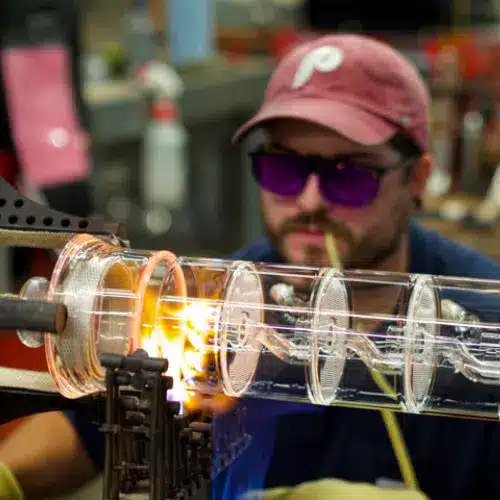 H.S Martin glassblower making a glass distillation column